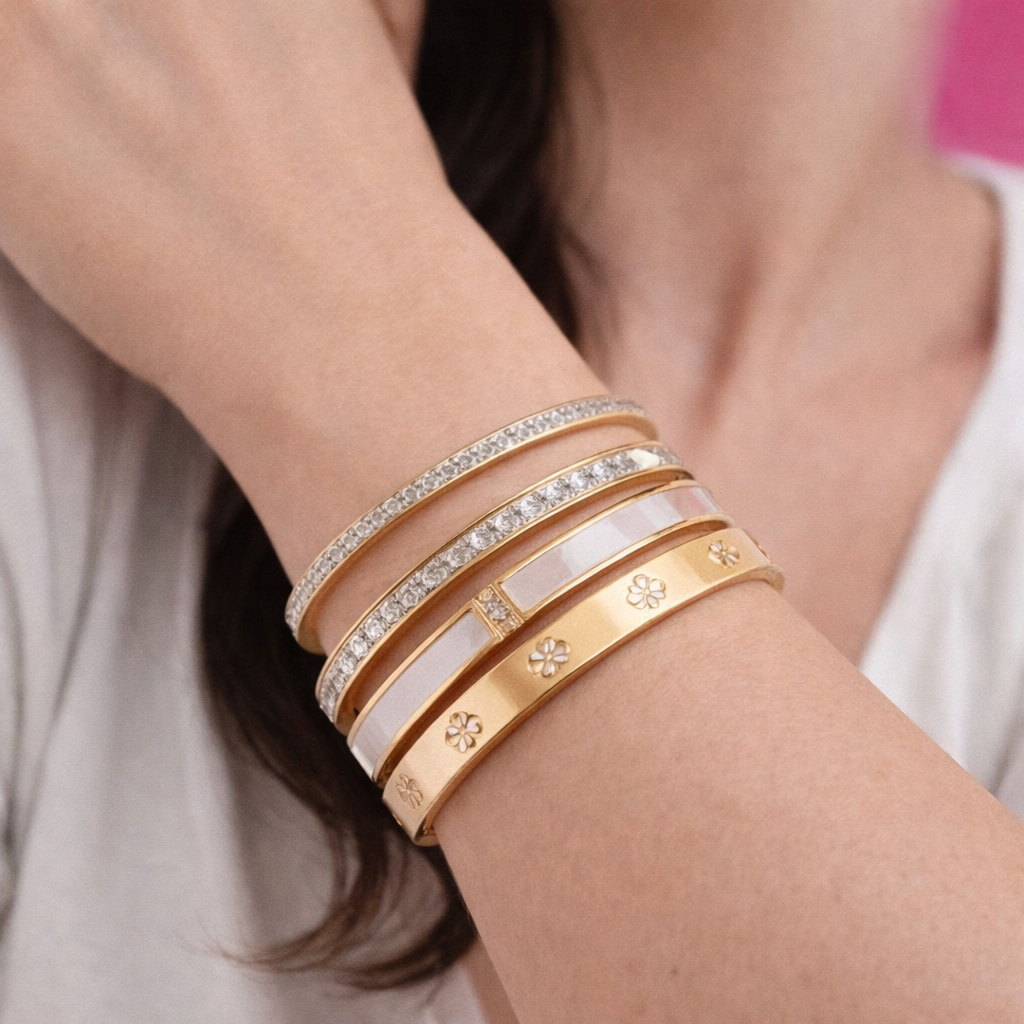 Pulsas laminadas en oro rodio flor y perlas